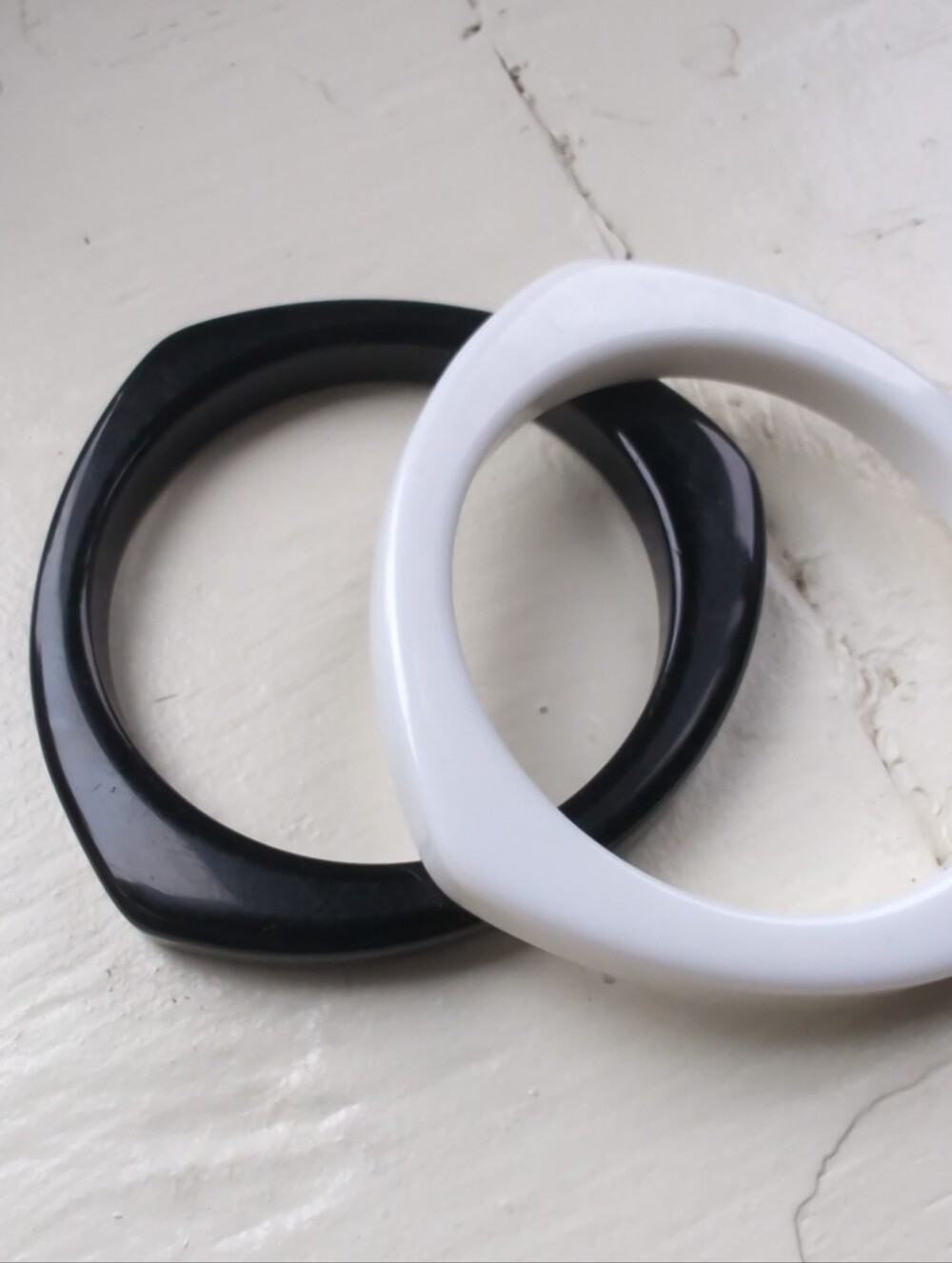 Set of black and white asymmetrical geometric plastic bangle bracelets